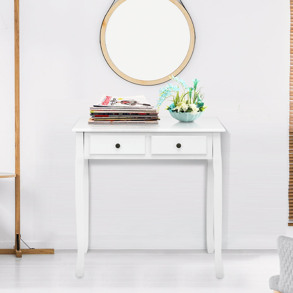 White writing desk with two tiers and four drawers, perfect for organizing as a vanity or computer desk.