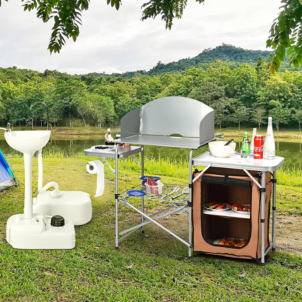 Foldable outdoor BBQ grilling table with windscreen, featuring aluminum construction, side tables, and zippered storage.