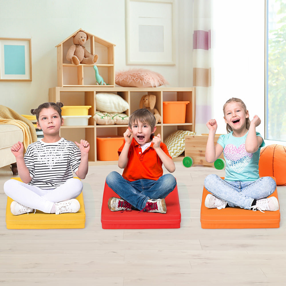 Colorful 15-inch square toddler floor cushions with handles, made of durable foam, ideal for kids' seating and play.