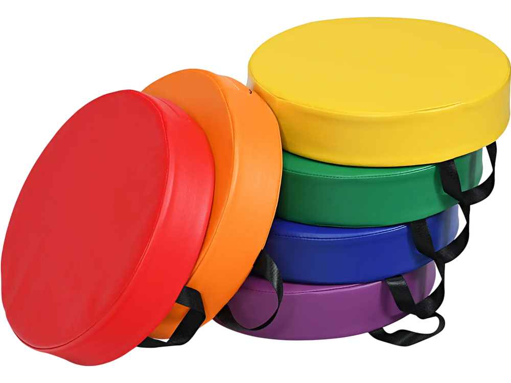 Multicolor 15-inch round toddler floor cushions with ergonomic handles, made of durable waterproof PU for kids' comfort.