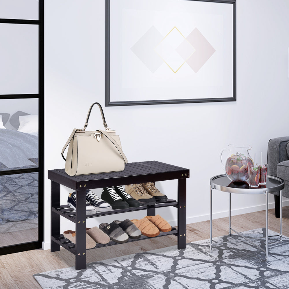 Black 3 tier bamboo bench storage shoe shelf with shoes and handbag, ideal for living room or bedroom organization.