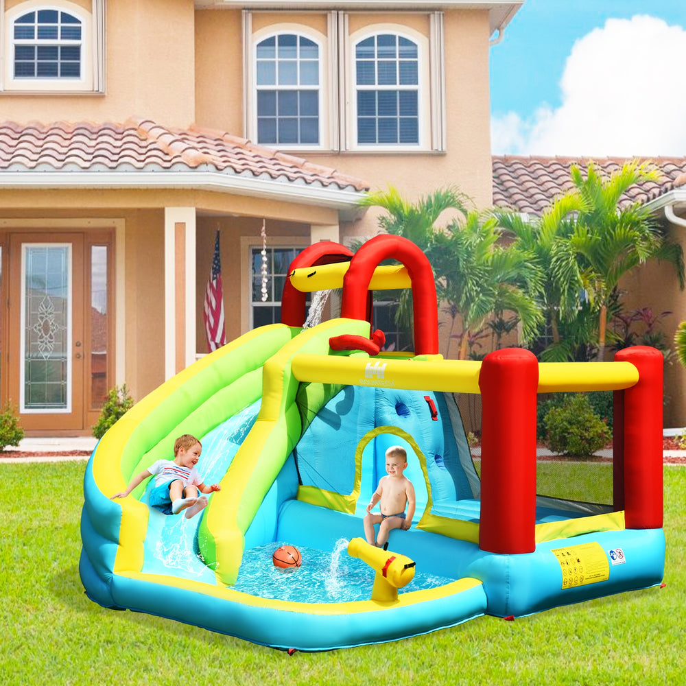 Colorful 6-in-1 inflatable bounce house with water slide and climbing wall, perfect for backyard summer fun.