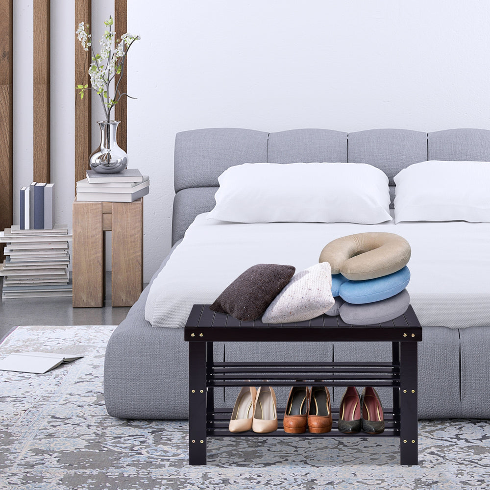 Black 3-tier bamboo bench storage shoe shelf with shoes and cushions, perfect for bedroom or living room use.