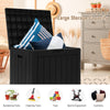 Black 30-gallon deck box with lockable lid, ideal for storing pillows and garden tools, doubles as a patio bench.
