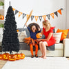 Black 6ft unlit artificial pencil tree with 520 branch tips, perfect for Halloween and festive decorations.