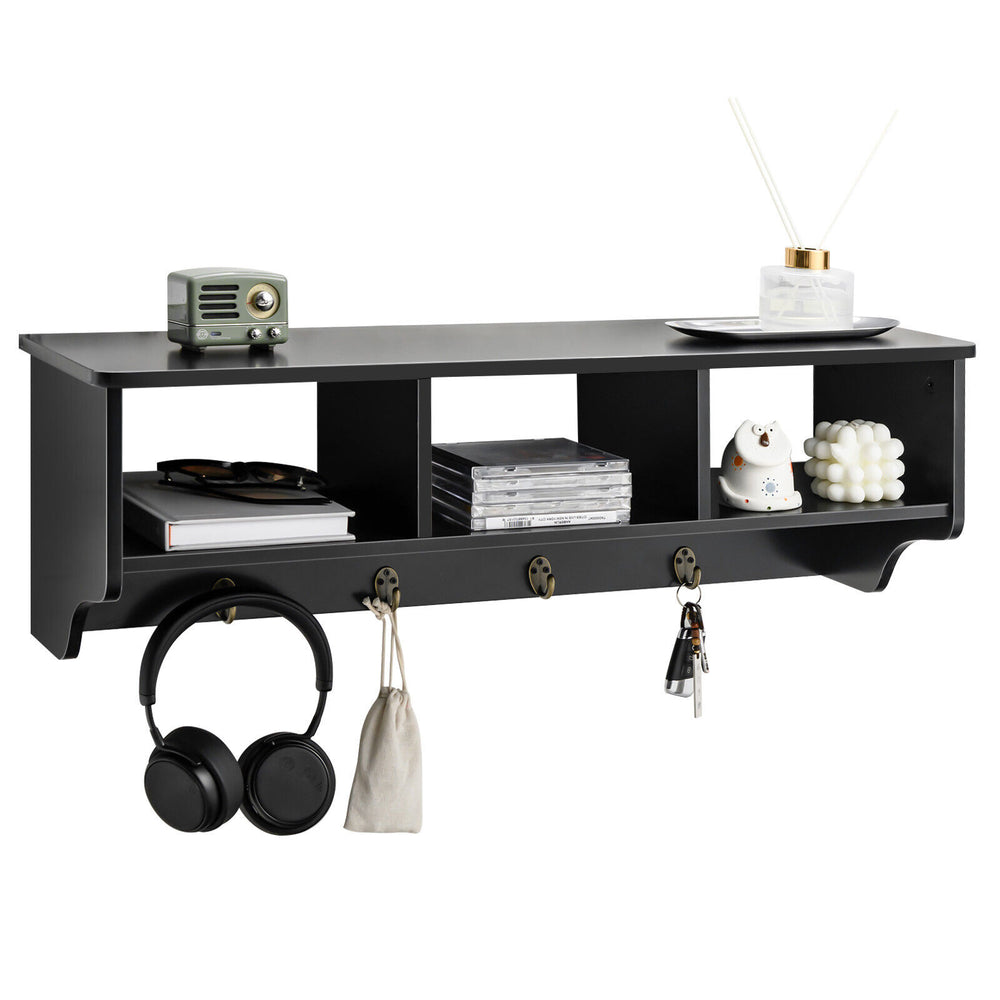 Wall-mounted black cubby organizer shelf with 4 hooks, perfect for entryway storage and displaying decor items.