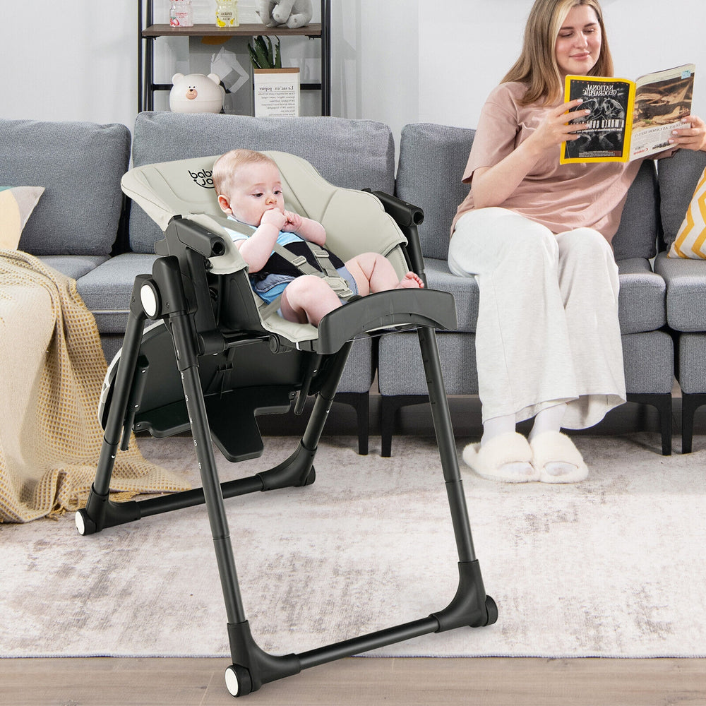 4-in-1 baby high chair in gray with adjustable height, removable trays, and rolling wheels for easy movement and safety.