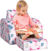 Convertible pink kid sofa bed with flamingo patterns, designed for comfort and relaxation in a playroom setting.
