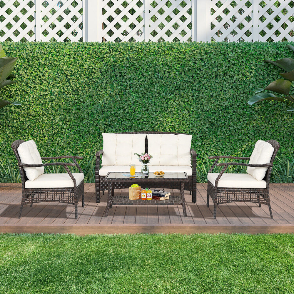 4-piece outdoor rattan conversation set with soft cushions, ergonomic design, and a stylish coffee table for patio.