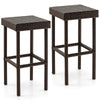 Set of two brown patio rattan wicker bar stools with sturdy steel frames, ideal for outdoor use by the poolside or.