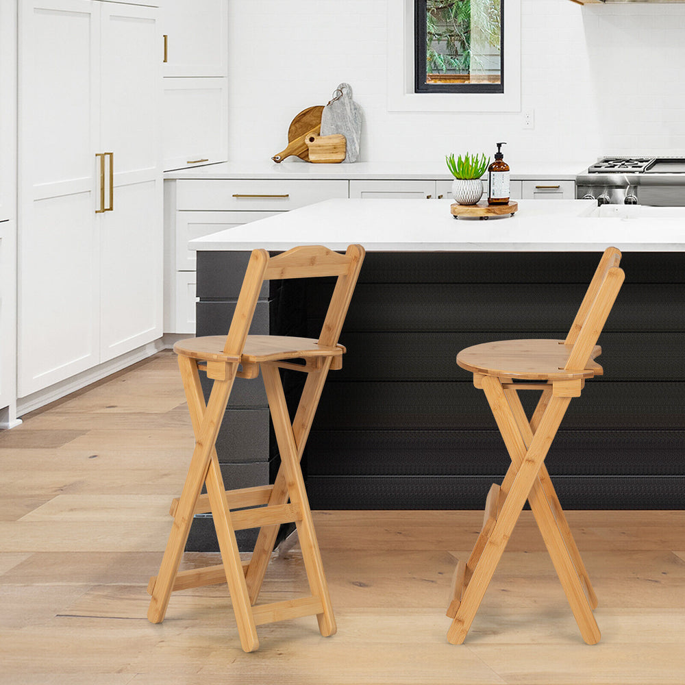 Set of 2 natural bamboo folding barstools with footrests, showcasing ergonomic design for comfort in a kitchen setting.