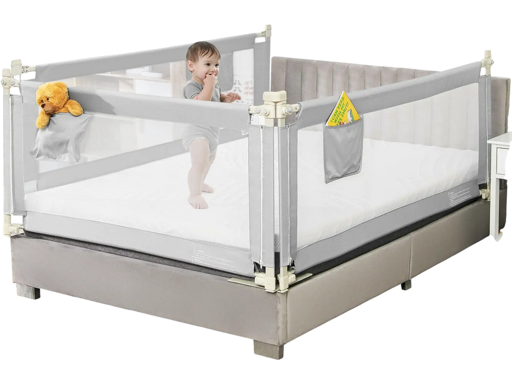 Gray toddler bed rail with round corners and a side pocket, designed for safety and convenience during sleep.