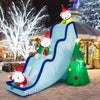 Inflatable polar bear slide decoration scene with Christmas tree and LED lights, ideal for festive outdoor celebrations.