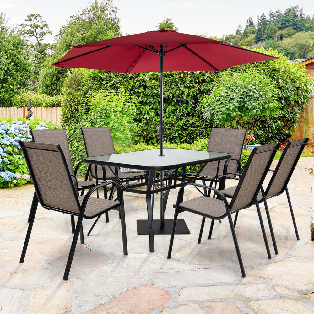 7-piece patio dining set featuring a rectangular glass table and 6 stackable chairs, perfect for outdoor gatherings.