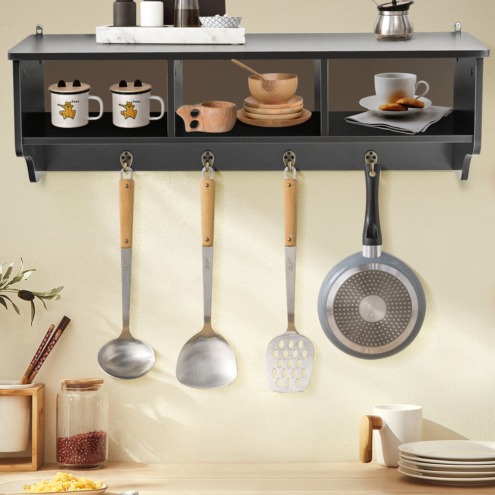 Wall-mounted black cubby organizer with four hooks, ideal for entryway or kitchen storage and display.
