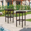Two brown patio rattan wicker bar stools with footrests, perfect for outdoor use by the poolside or backyard.