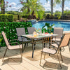 Ergonomic stackable chair from the 7-piece patio dining set, featuring breathable fabric and inclined backrest for.