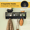 Wall-mounted black cubby organizer shelf with 4 hooks, ideal for entryway storage and displaying decor.