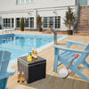 Black 10-gallon storage cooler with wood texture, used as a side table by the pool for outdoor activities.