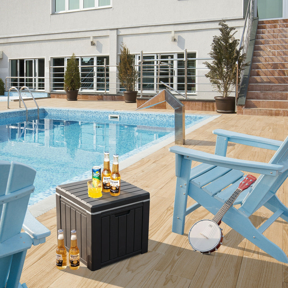 Black 10-gallon storage cooler with wood texture, used as a side table by the pool for outdoor activities.