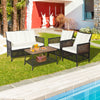 4-piece patio rattan furniture set with white cushions and acacia wood coffee table for outdoor relaxation.
