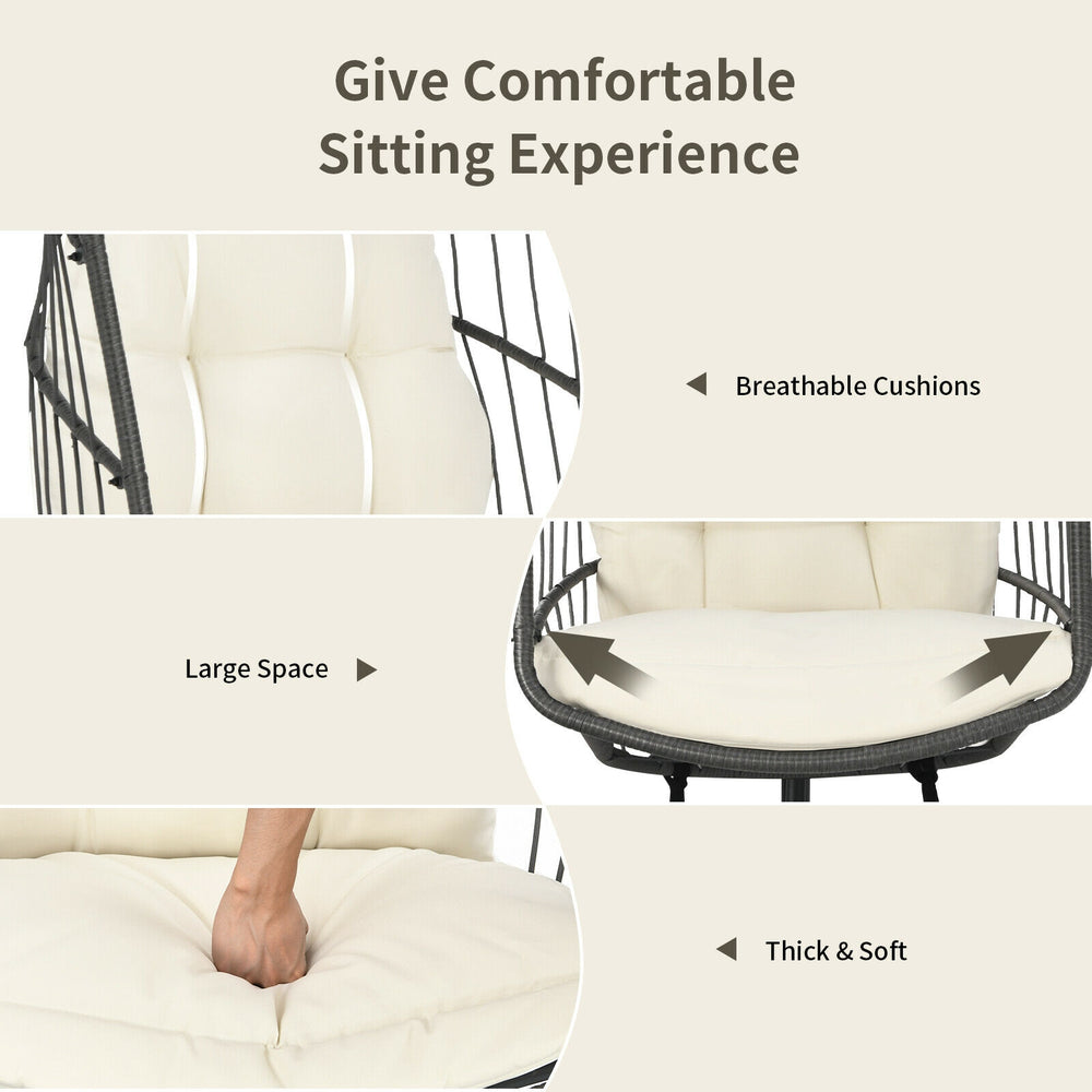 Hanging wicker egg chair with beige cushions, featuring a spacious design for optimal comfort and safety.