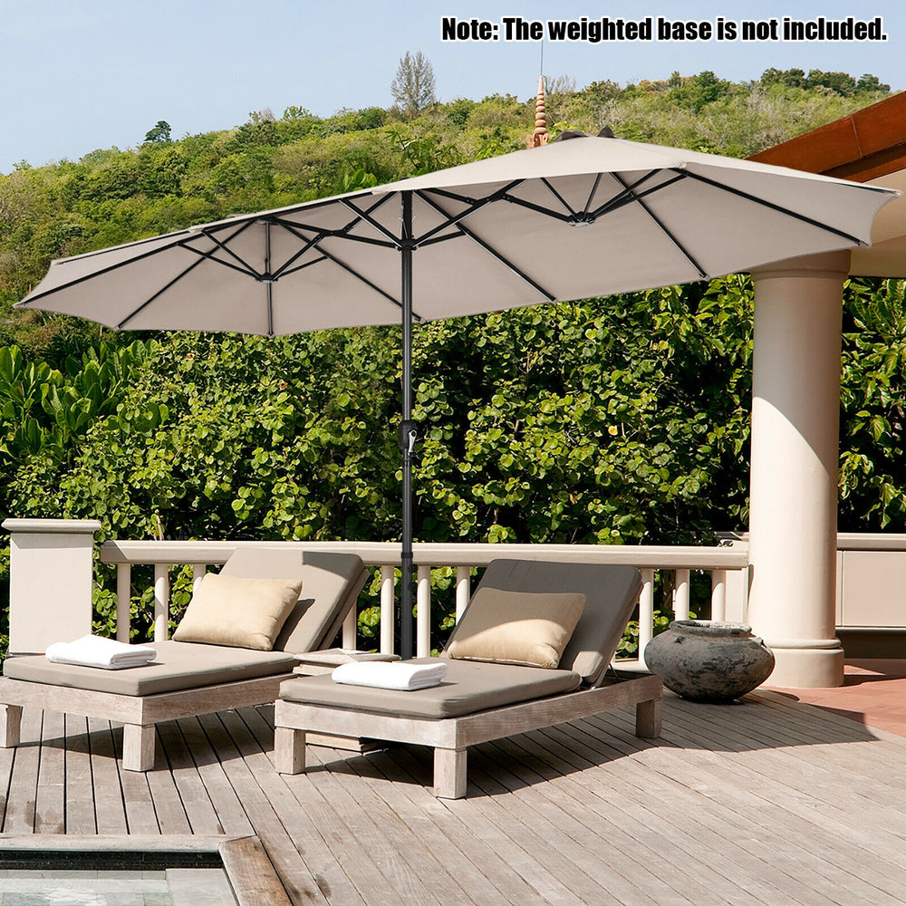 Double-sided 15 feet patio umbrella in beige with hand-crank system, providing ample shade for outdoor relaxation.