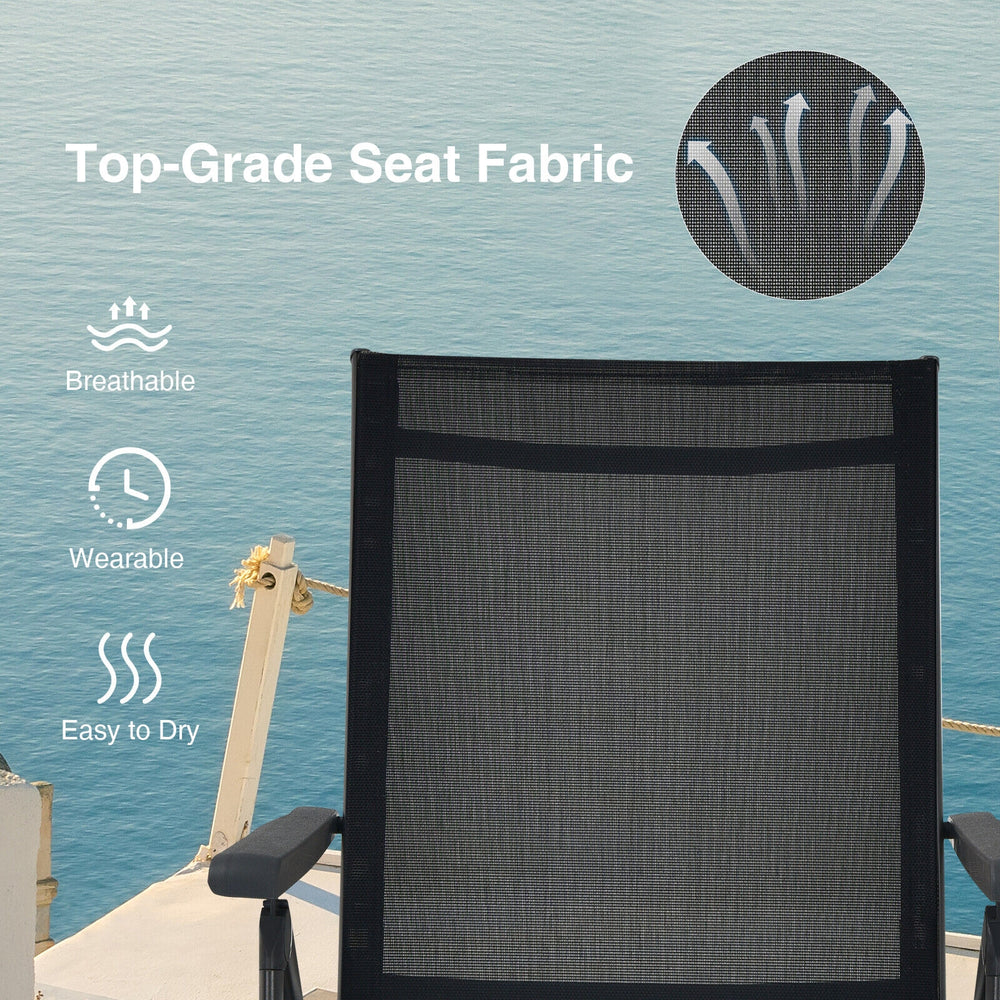 Close-up of the breathable seat fabric of a black foldable chaise lounge chair, ideal for outdoor relaxation.