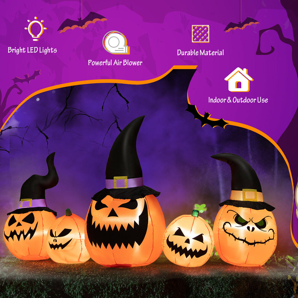 Inflatable pumpkin family decoration with LED lights, featuring three large and two small pumpkins for Halloween yard.