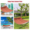 Red outdoor hammock with detachable pillow, perfect for relaxing in the backyard, beach, or courtyard.