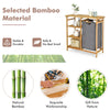 Bamboo laundry hamper stand showcasing smooth varnished surface and removable sliding bag, perfect for neat.