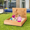 Kids playing in a wooden square sandbox with cover, featuring solid cedar wood and unique sand walls for fun.