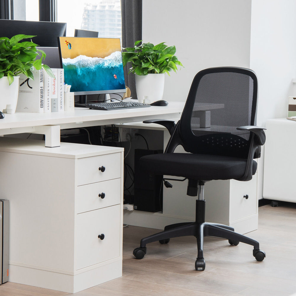 Adjustable black mesh office chair with flip-up armrests and ergonomic backrest for comfortable desk use.