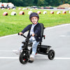 Toddler riding the 4-in-1 Baby Tricycle in blue, featuring a convertible seat and adjustable canopy for versatile use.