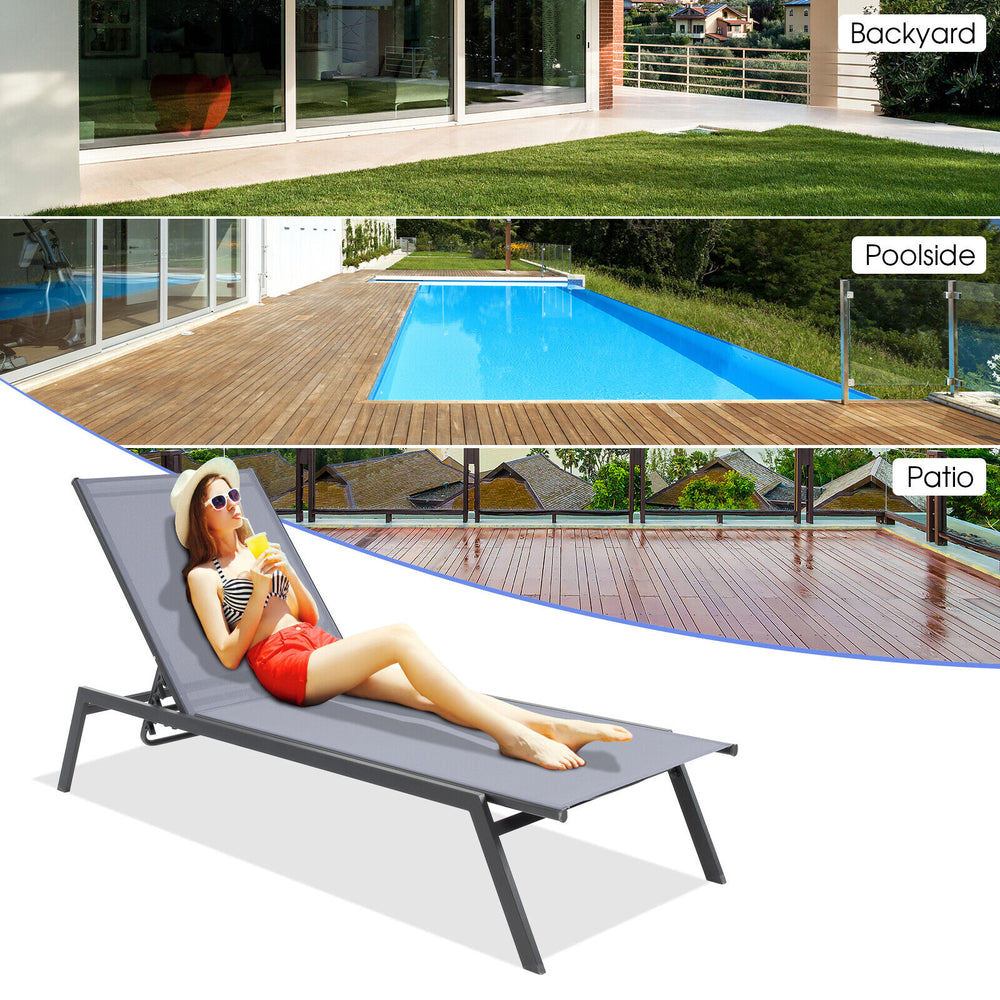Outdoor adjustable chaise lounge chair in gray, featuring a sturdy steel frame, perfect for sunbathing by the poolside.