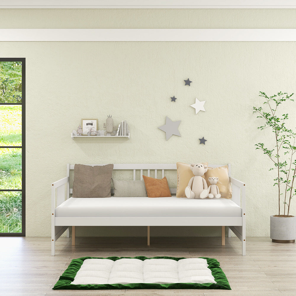 White wooden full-size daybed frame with guardrails, styled as a sofa, featuring plush cushions for comfort and decor.