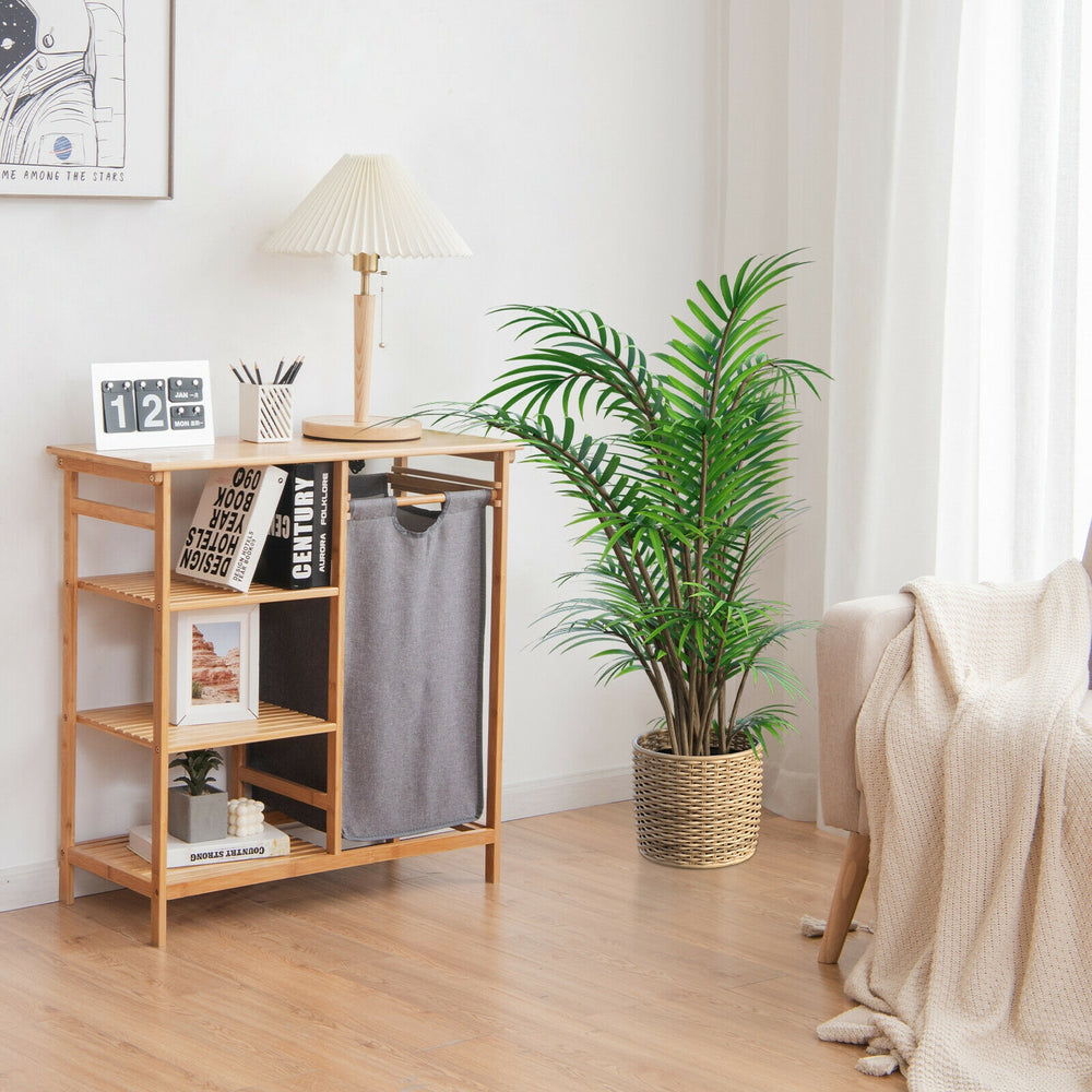 Bamboo laundry hamper stand featuring a spacious countertop and three open shelves, perfect for organizing laundry.