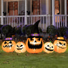 Inflatable pumpkin family with wizard hats, featuring bright LED lights, perfect for Halloween yard decoration.