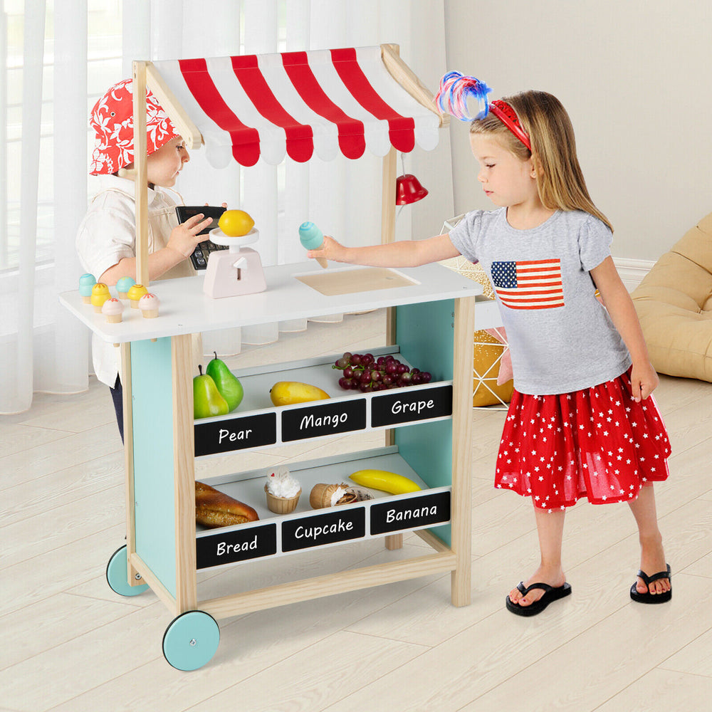 Kids wooden ice cream cart in red with chalkboard, featuring shelves and toy accessories for imaginative play.