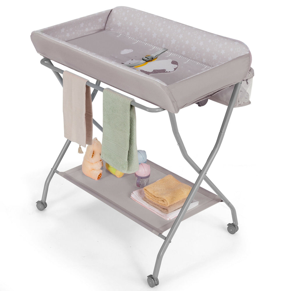 Gray baby changing table with soft, supportive top and height chart, designed for safety and convenience during baby.