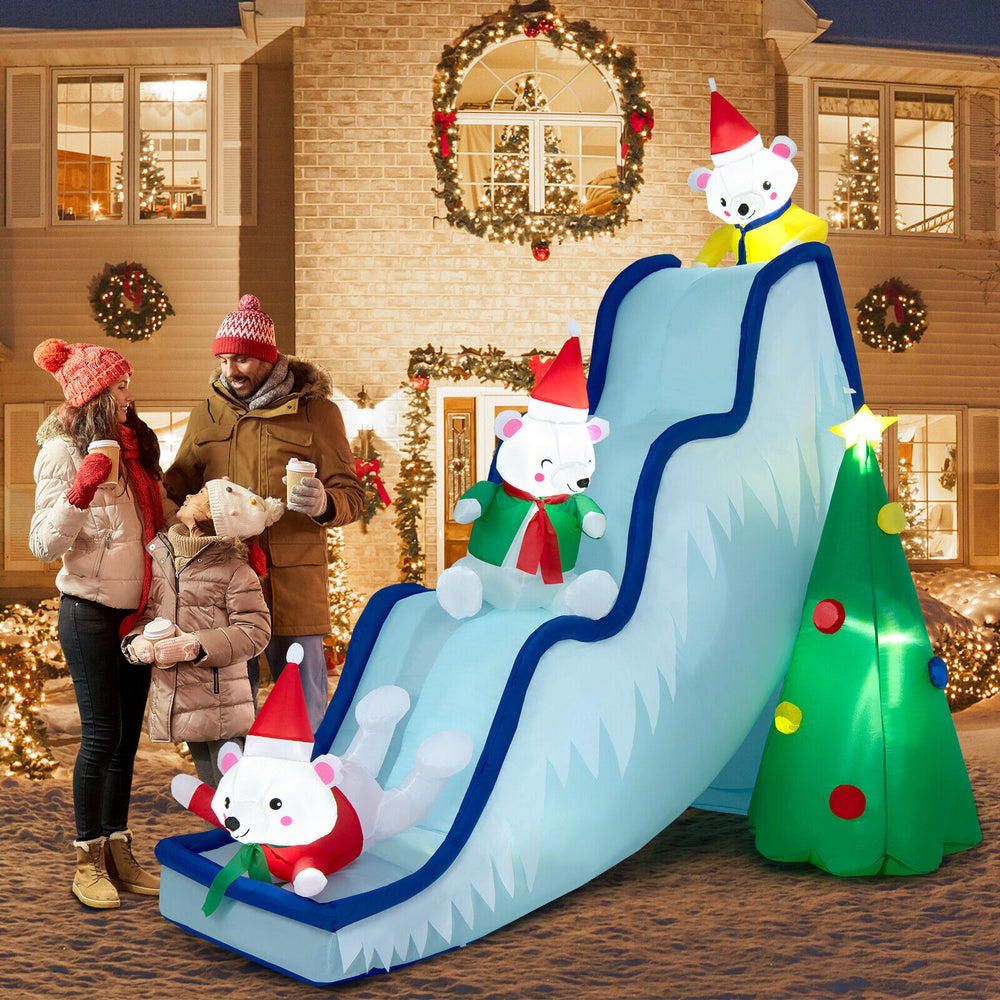 Polar bear slide decoration scene with Christmas tree and LED lights, designed for festive outdoor holiday.