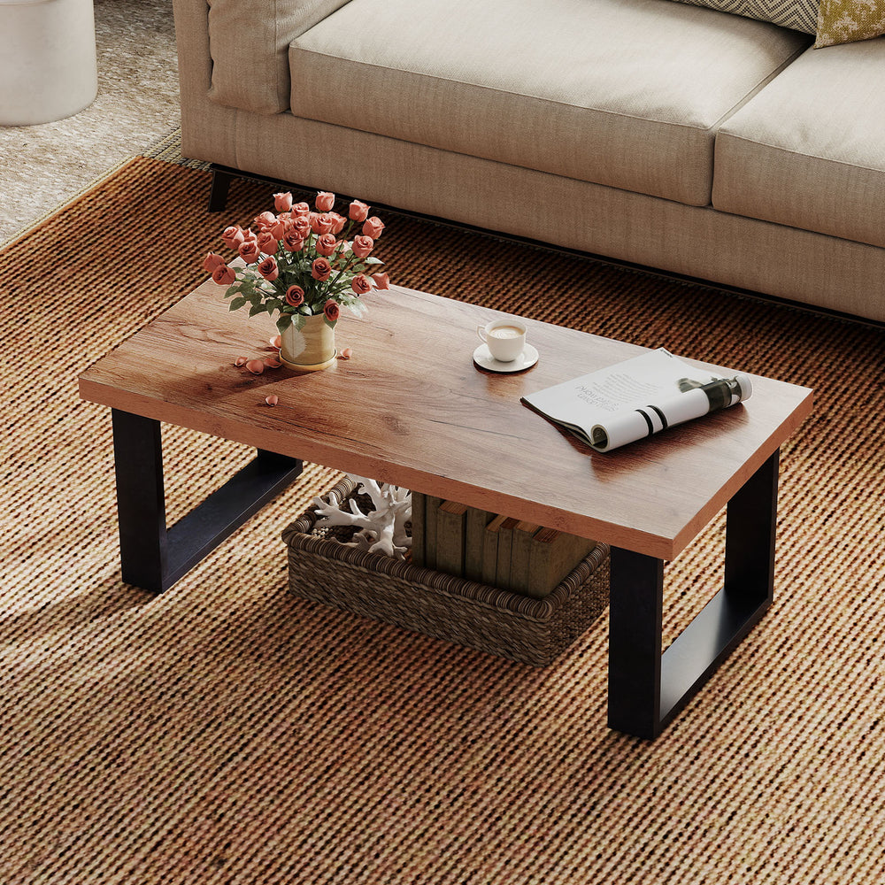 Rustic 47-inch coffee table with thick oak tabletop, natural wood texture, and sturdy black metal legs for living room.