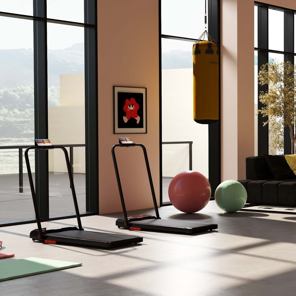 Folding treadmill and hanging punching bag set in a modern fitness room, ideal for home workouts and training.