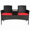 Modern patio conversation set featuring a built-in trapezoid coffee table and red cushions for outdoor comfort.