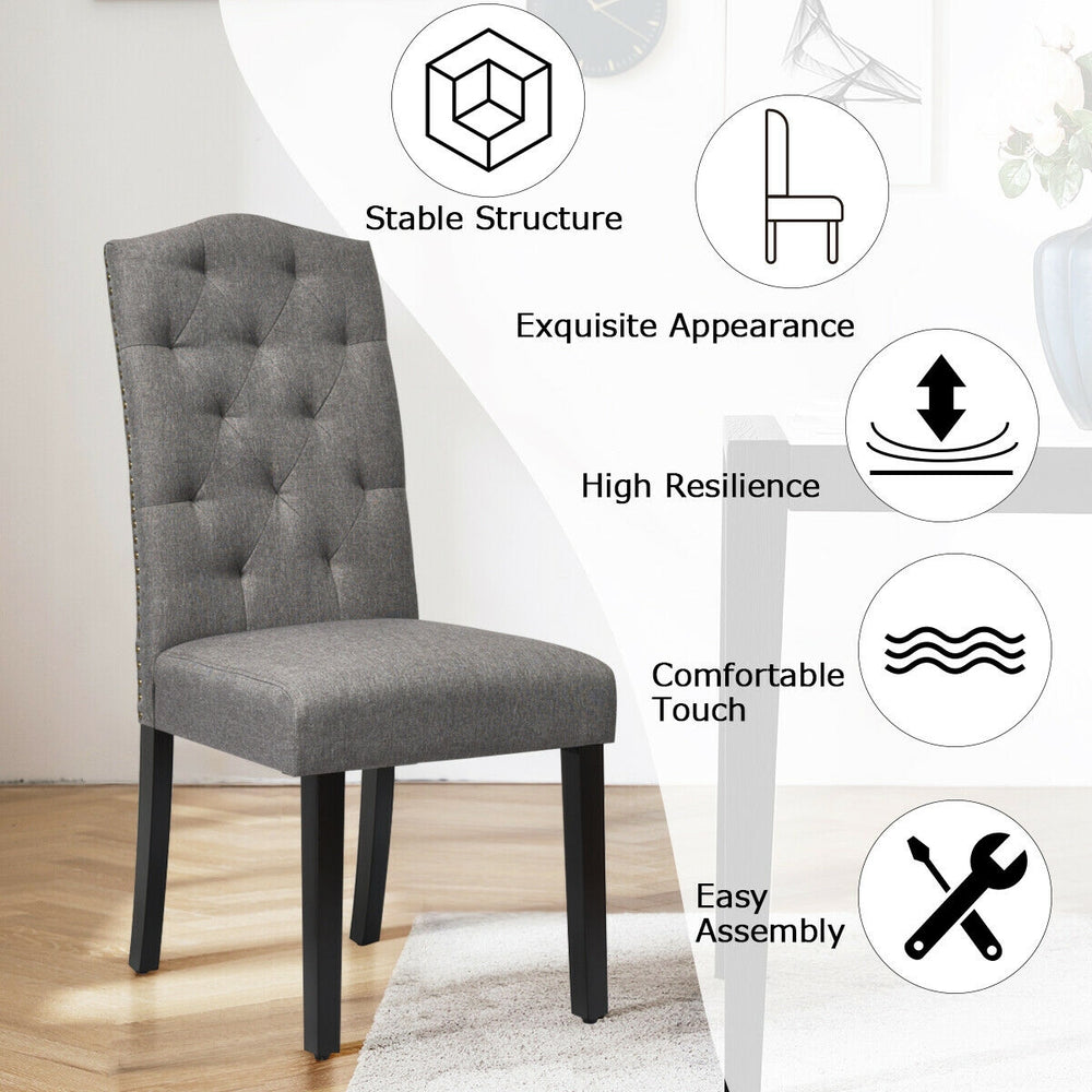 Tufted gray upholstered dining chair with rubberwood legs, ergonomic backrest, and breathable linen fabric for comfort.