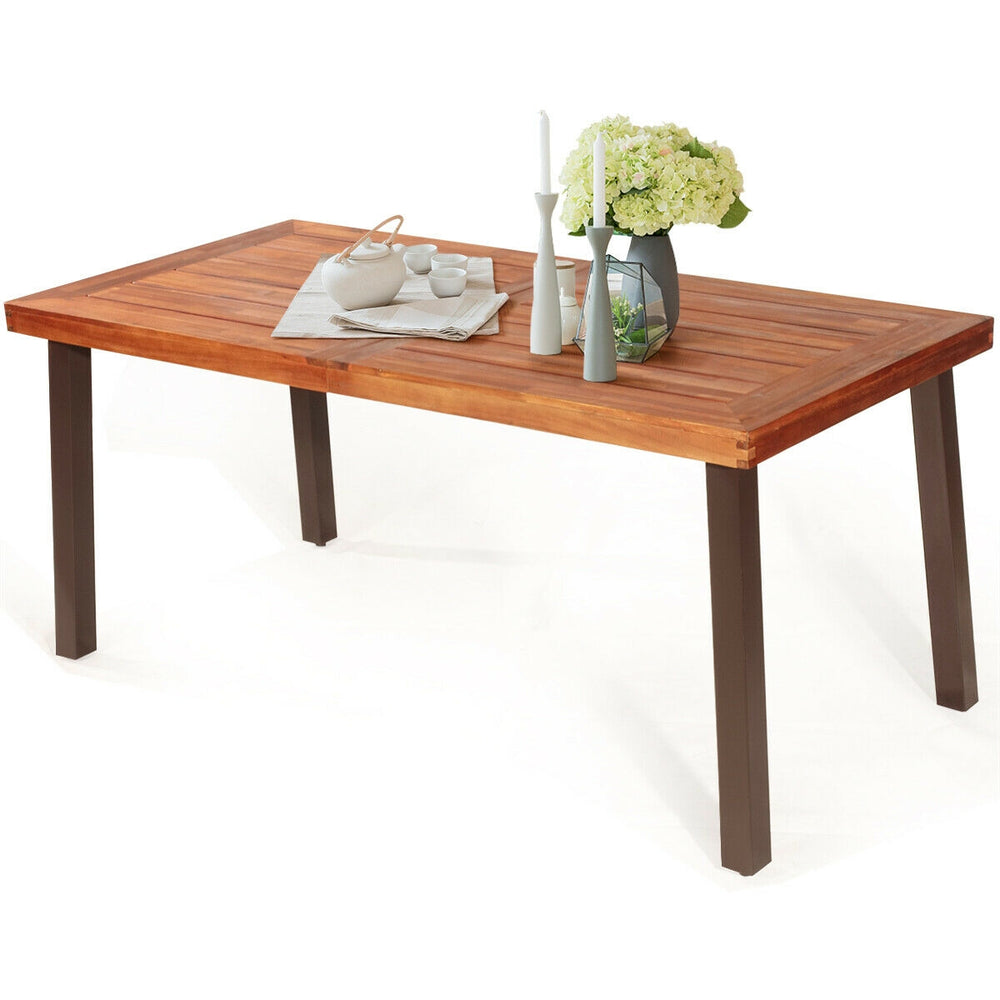 Rectangular acacia wood dining table with steel legs, featuring a waterproof surface and umbrella hole, ideal for.