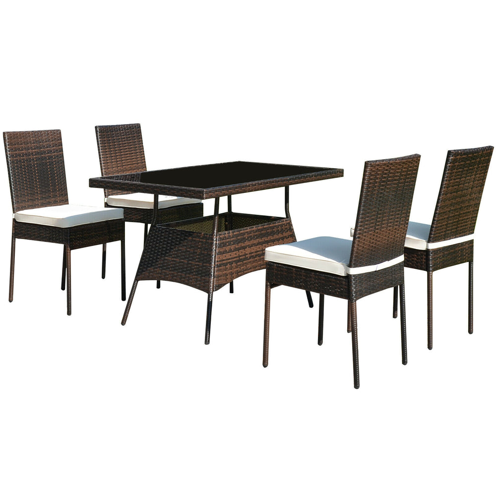 View of the complete 5-piece rattan dining set, showcasing a modern design with a glass table and comfortable chairs.