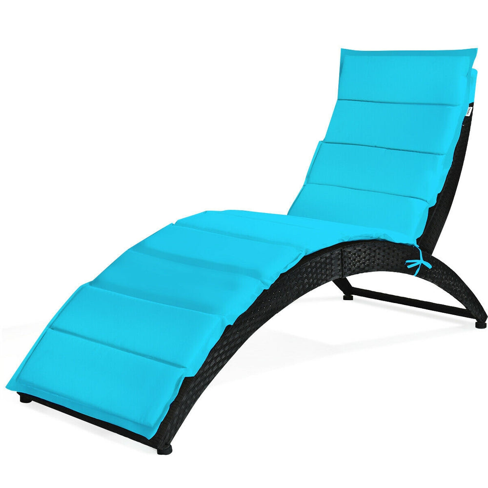 Turquoise folding patio lounge chair with cushion, made of weather-resistant PE rattan, ideal for outdoor relaxation.
