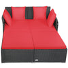 Spacious outdoor rattan daybed with red cushions, offering ample space for relaxation and a sturdy aluminum frame.