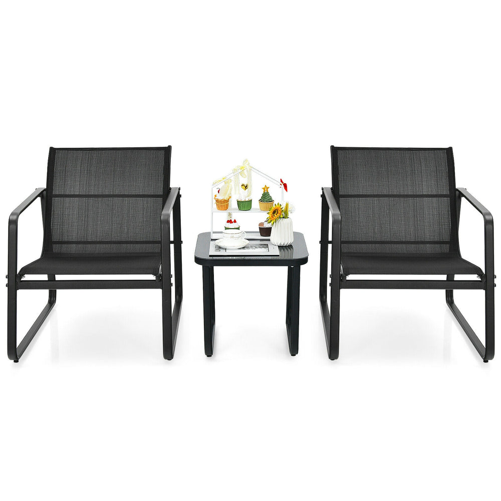 Two ergonomic black patio chairs with a glass top table, perfect for outdoor relaxation in gardens or backyards.